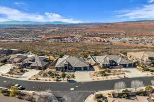 Aerial perspective of suburban area featuring a mountain backdrop