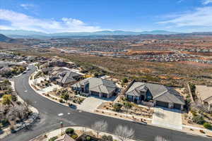 Aerial perspective of suburban area with a mountainous background