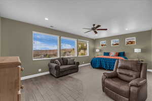 Bedroom featuring ceiling fan, wood finish floors, and recessed lighting