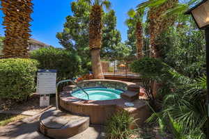 View of pool with a community hot tub