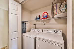 Washroom featuring separate washer and dryer