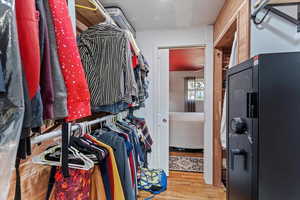 Walk in closet featuring light wood finished floors
