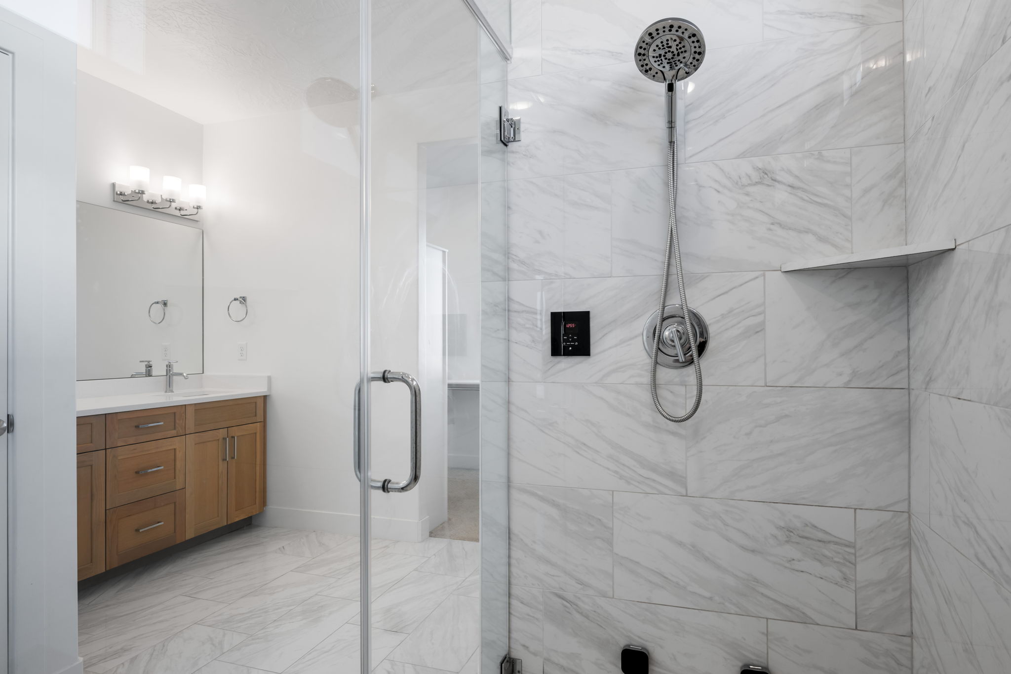 Bathroom with vanity and a shower stall