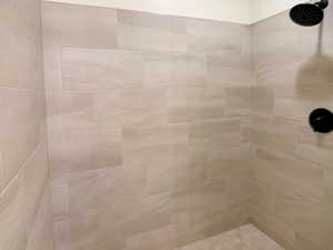 Bathroom featuring tiled shower