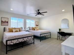Bedroom featuring light carpet, ceiling fan, recessed lighting, and an office area