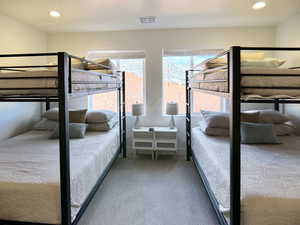 Bedroom featuring recessed lighting and light carpet