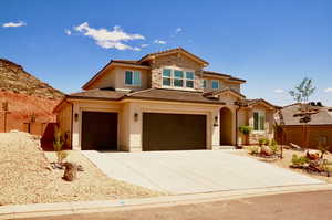 Mediterranean / spanish-style house featuring stucco siding, concrete driveway, an attached garage, and a tile roof