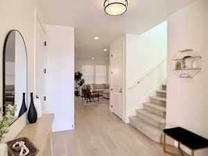 Foyer featuring light wood-style flooring and recessed lighting