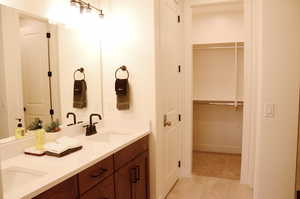 Primary Bathroom with Double Vanity and a Walk-in Closet