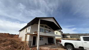 Back of house featuring a balcony