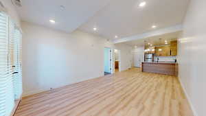 Unfurnished living room featuring light wood finished floors and recessed lighting