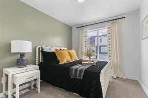 Bedroom with carpet flooring and a textured ceiling