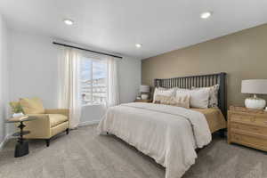 Carpeted bedroom featuring baseboards and recessed lighting