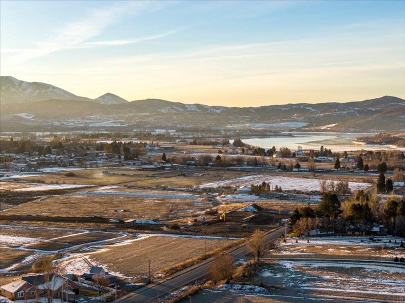 View of mountain backdrop featuring a large body of water