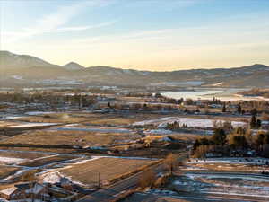 View of mountain backdrop featuring a large body of water