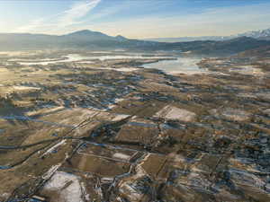 Aerial overview of property's location with a water and mountain view