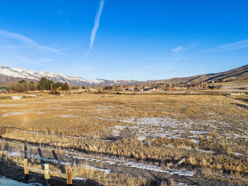 View of mountain backdrop with rural landscape