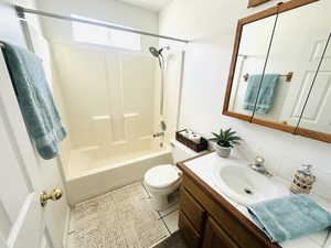 Full bath featuring bathing tub / shower combination and vanity