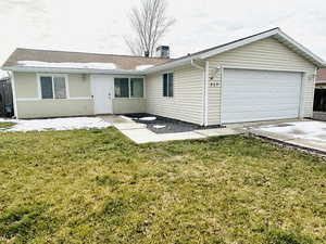 View of front of home featuring a garage, concrete driveway, and roof with shingles