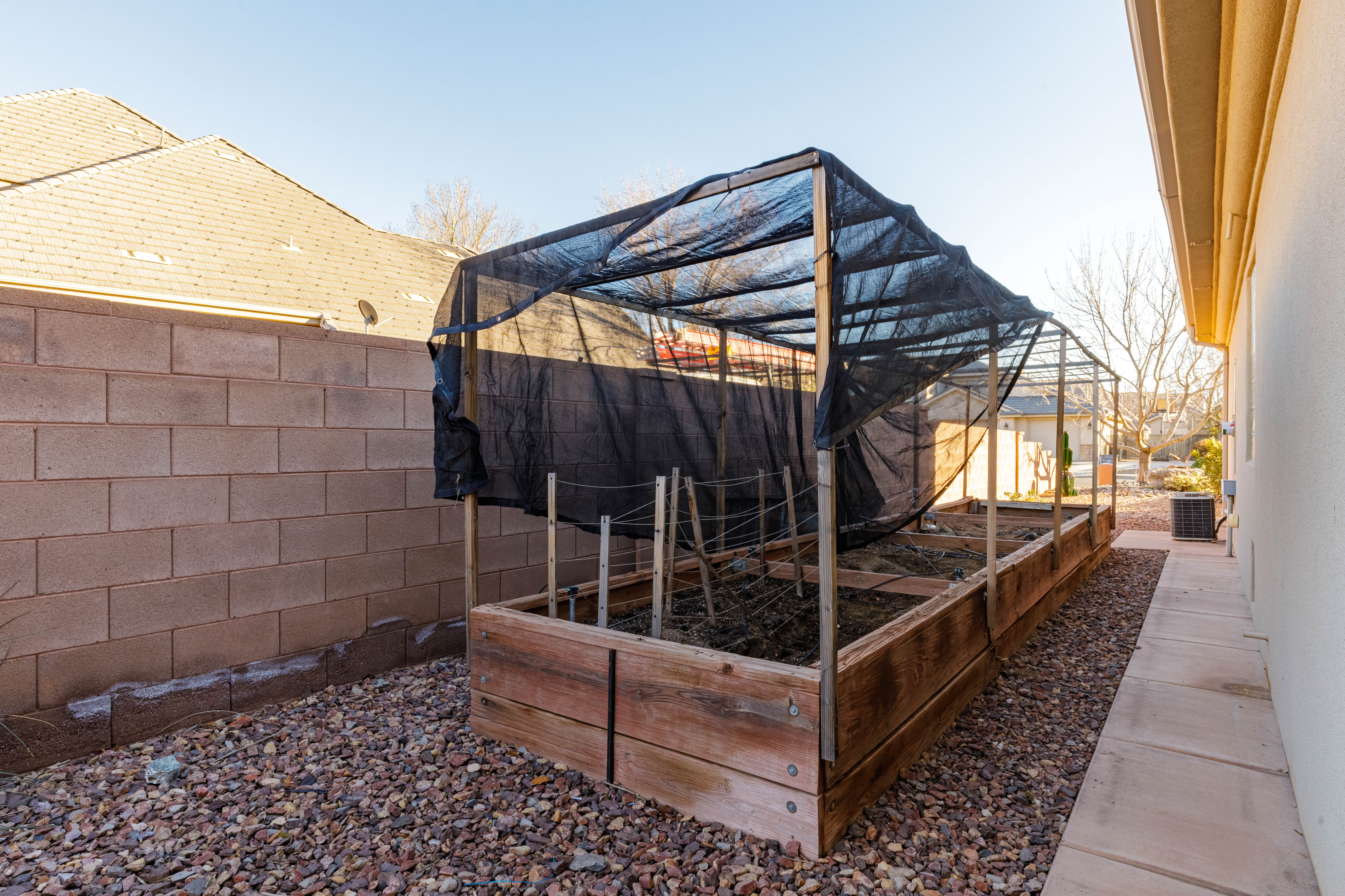 Wooden terrace featuring a vegetable garden