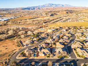 View of property location featuring mountains and nearby suburban area