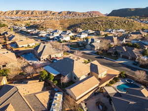 Aerial perspective of suburban area with a mountainous background
