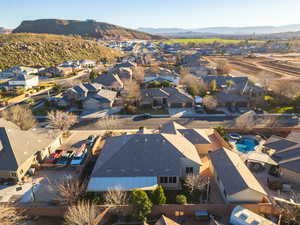 Aerial perspective of suburban area featuring a mountainous background