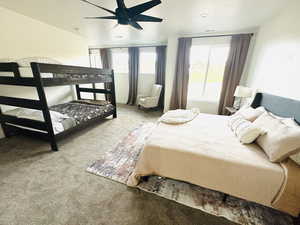 Bedroom featuring carpet flooring and ceiling fan