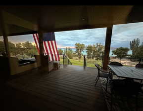 Wooden deck featuring outdoor dining space