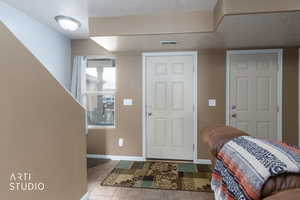 Tiled entryway with baseboards