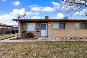 Ranch-style home featuring brick siding