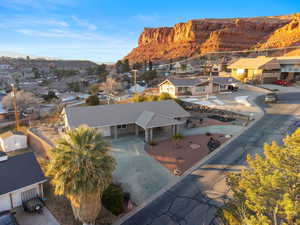 Aerial perspective of suburban area featuring a mountain backdrop