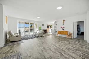 Living room featuring baseboards and built in features