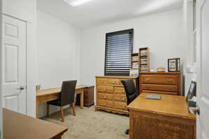 Office area with light colored carpet