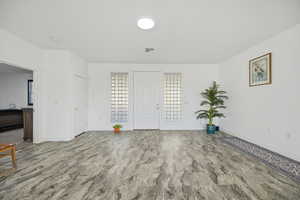 Unfurnished room with baseboards and wood finished floors