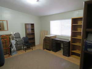 Home office with light wood-style floors