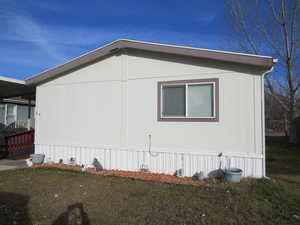 View of home's exterior featuring a lawn