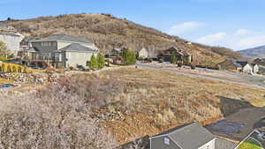 View of mountain backdrop featuring nearby suburban area