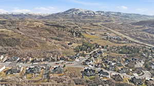 View of property location with nearby suburban area and mountains