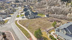 Aerial view of property and surrounding area with nearby suburban area