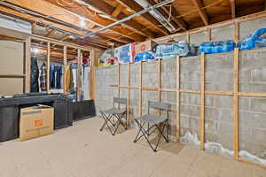 Unfinished basement featuring tile patterned floors
