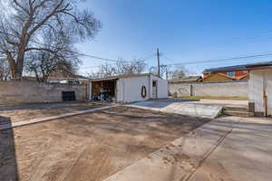 View of outdoor structure featuring a fenced backyard