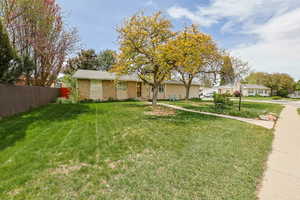 Ranch-style house with brick siding