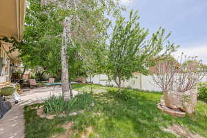 Fenced backyard with a patio