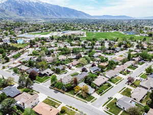 Aerial view of residential area featuring a mountainous background