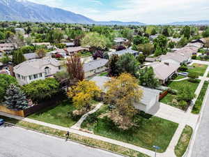 Aerial view of residential area featuring a mountainous background