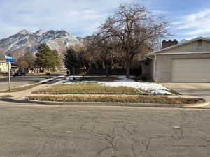 View of front facade featuring driveway and a mountain view