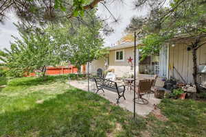 Fenced yard with a patio area