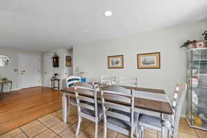 Dining area featuring light tile patterned floors and recessed lighting