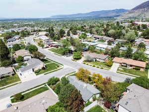 Aerial perspective of suburban area featuring a mountainous background